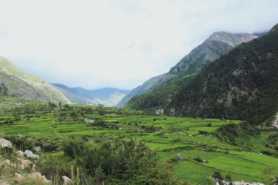 Scenic view of landscape and mountains against sky