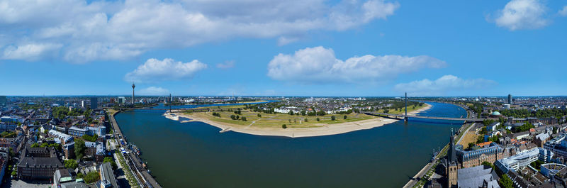 High angle view of buildings against cloudy sky