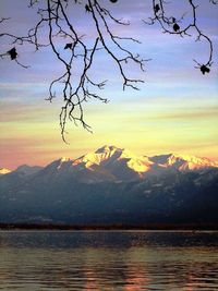 Scenic view of lake against sky during sunset