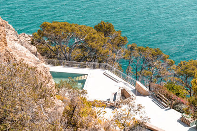 Outdoor pool in the apartment building on the coast of spain next to the sea