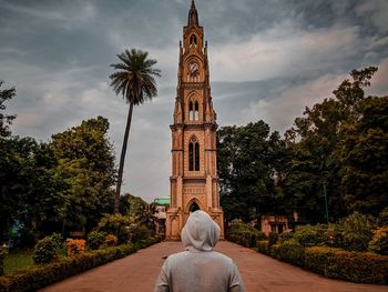 Traveller looking at a clocktower 