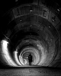 Man standing in tunnel