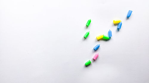 High angle view of pills on white background