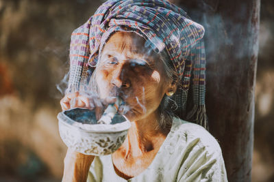 Portrait of woman holding ice cream