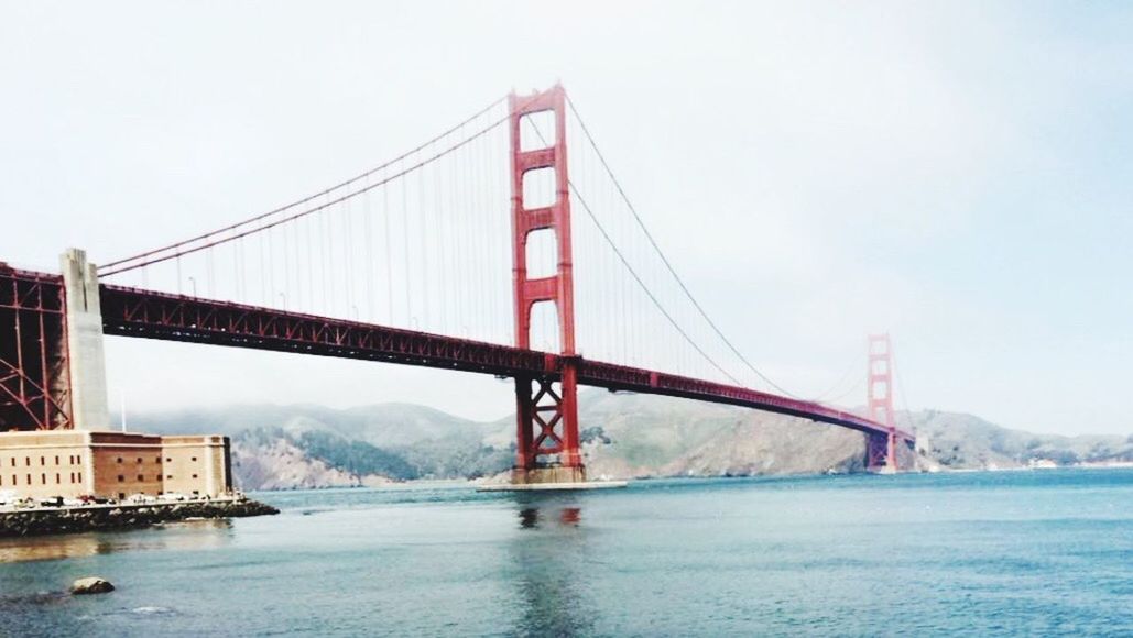 LOW ANGLE VIEW OF GOLDEN GATE BRIDGE OVER RIVER