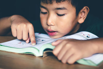 Portrait of boy with book