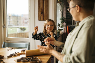 Mother and daughter making cookies