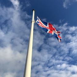 Low angle view of flag against sky