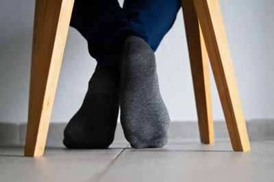 Low section of person standing on floor at home