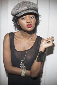 Portrait of young woman wearing hat