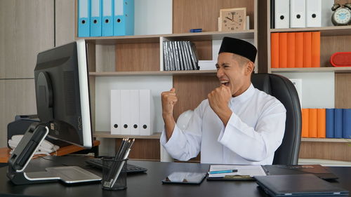 Side view of man using mobile phone