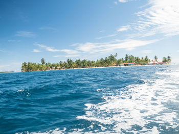 Scenic view of sea against blue sky