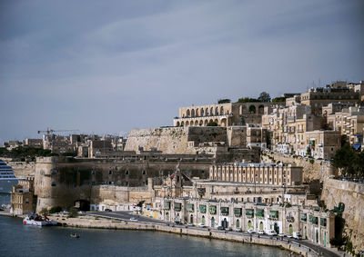 Buildings in city against sky