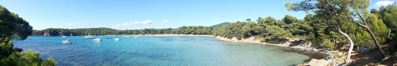 Panoramic view of sea against blue sky