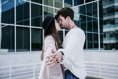 Young couple standing outdoors