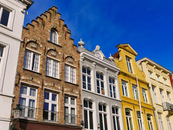 Low angle view of building against blue sky