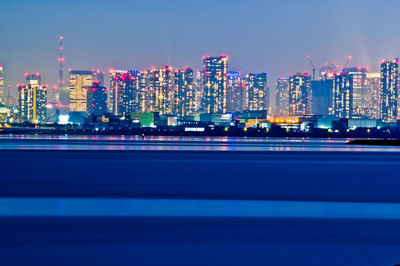 Illuminated buildings in city at night