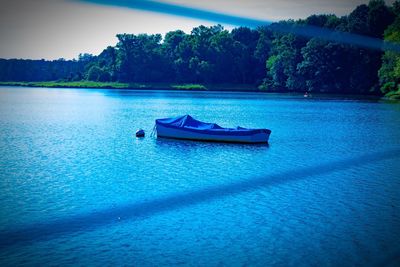 Boats in calm lake