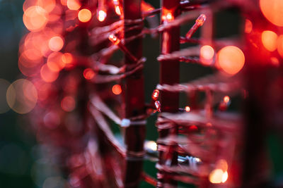 Defocused image of illuminated christmas lights at night