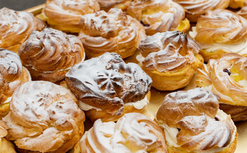 Cream puffs filled with cream and fruity cherries