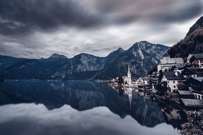 Scenic view of hallstatt and mountains reflection in hallstatter see