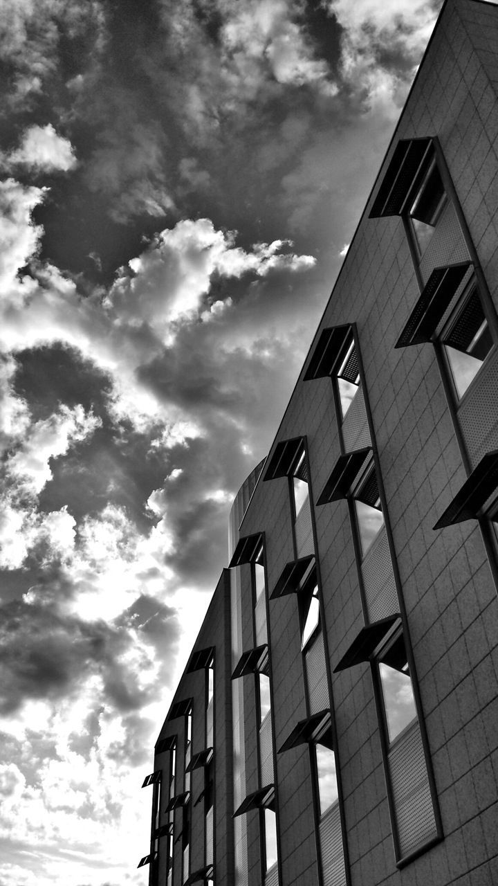 architecture, building exterior, built structure, sky, low angle view, cloud - sky, cloud, building, window, cloudy, city, residential structure, residential building, day, outdoors, modern, no people, office building, sunlight, tall - high