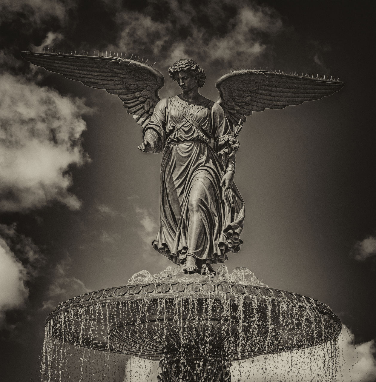 black and white, monochrome, monochrome photography, angel, wing, statue, animal, sculpture, animal wing, sky, cloud, darkness, craft, no people, architecture, nature, animal themes, history, the past, creativity, representation, religion, animal body part, fairy, monument, belief, spirituality, black, outdoors