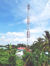 Low angle view of communications tower against sky