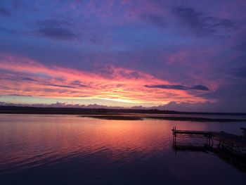 Scenic view of lake against romantic sky during sunset