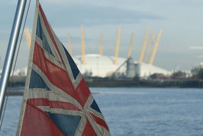 Close up of red balloon against sky