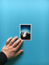 Close-up of a person hand in the mirror