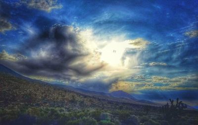 Scenic view of landscape against dramatic sky