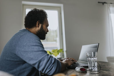 Man working on laptop from home