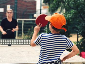 Boys playing in front of building