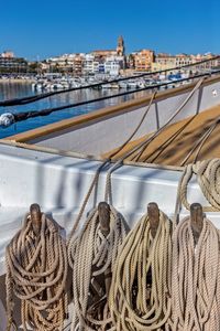 Sail ship detail and small spanish town in costa brava, palamos