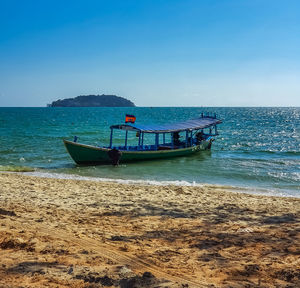 Scenic view of sea against clear blue sky