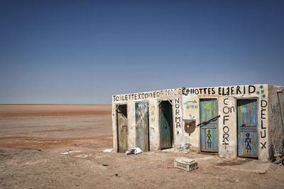 Old ruin on desert against clear blue sky