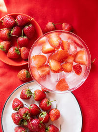 High angle view of strawberries in glass on table