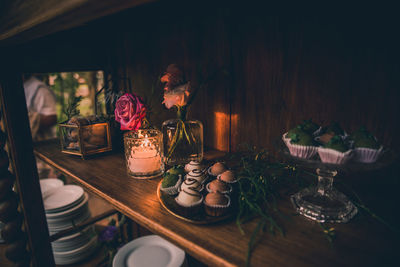 High angle view of potted plant and decoration on shelf