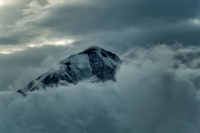 Scenic view of snowcapped mountain against sky