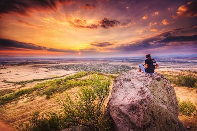 Scenic view of landscape against cloudy sky