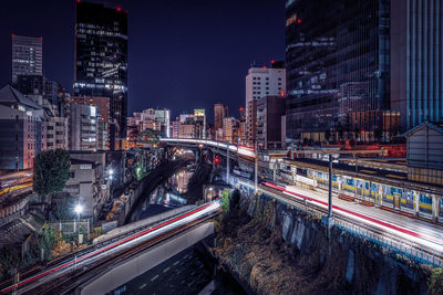 Illuminated buildings in city at night