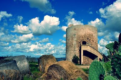 Old ruin on field against sky