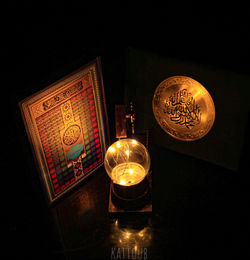 High angle view of illuminated electric lamp on table