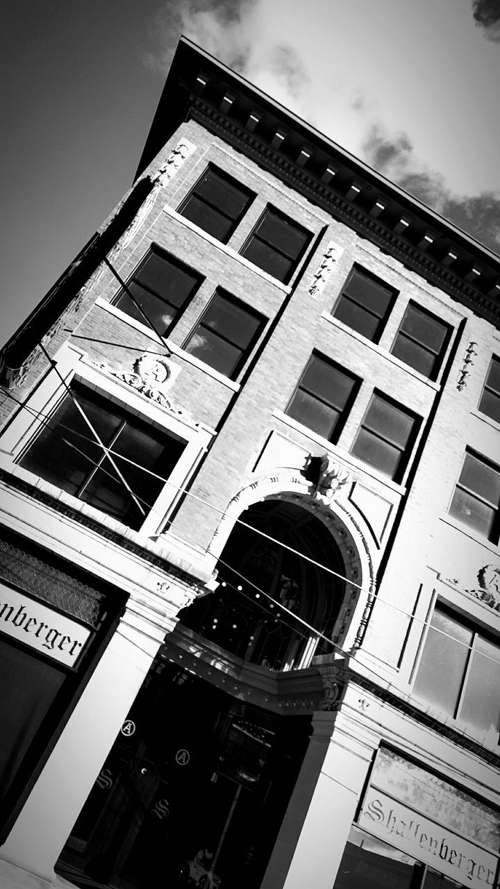 architecture, low angle view, building exterior, built structure, sky, tower, tall - high, city, window, building, modern, day, travel destinations, outdoors, famous place, history, no people, glass - material, architectural feature, capital cities