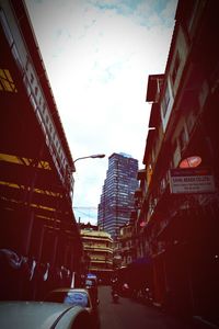 Low angle view of city street against sky