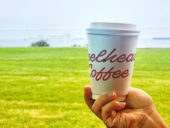 Cropped hand holding coffee