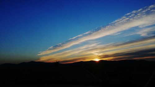 Scenic view of silhouette landscape against sky during sunset