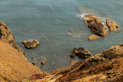 High angle view of rocks on beach, ponta de são lourenco, madeira, portugal