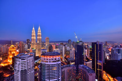 Illuminated buildings in city at night